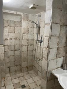 a bathroom with a shower and a sink at Il cortiletto in Gaeta