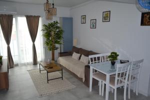 a living room with a couch and a table at Apartament POK in Constanţa