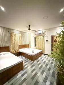 Postel nebo postele na pokoji v ubytování Tulip Inn - 3BHK-G AC Near Kamakhya