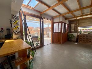 a room with a large glass door and a balcony at Casa Pau in Santa Maria