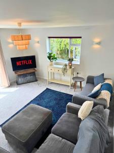 a living room with a couch and a fireplace at Amazing City Centre Home in Derby