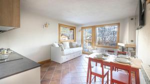 a living room with a couch and a table at InstaView in Ponte di Legno