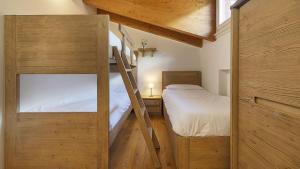 Postel nebo postele na pokoji v ubytování Chalet la Segheria