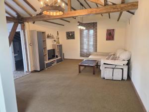 a living room with a couch and a table at Parque Remonta in Santander +12 photos