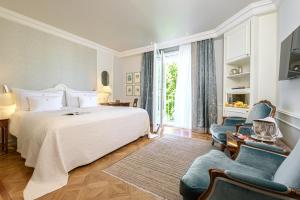 Postel nebo postele na pokoji v ubytování Colombi Hotel