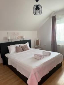 Postel nebo postele na pokoji v ubytování Apartman Magnolia