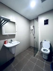 a bathroom with a sink and a toilet at Aurora Homes at i-City - WiFi TV Box and 1 Carpark in Shah Alam