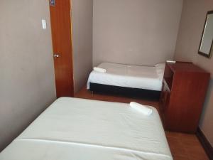 Postel nebo postele na pokoji v ubytování Hotel Milan Cartagena