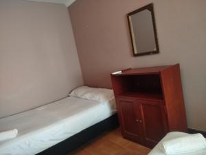 Postel nebo postele na pokoji v ubytování Hotel Milan Cartagena