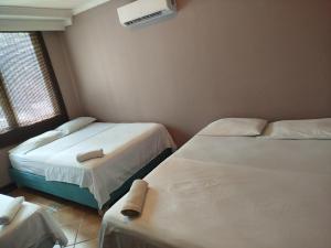 Postel nebo postele na pokoji v ubytování Hotel Milan Cartagena