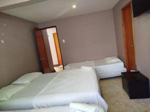 Postel nebo postele na pokoji v ubytování Hotel Milan Cartagena