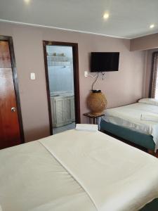 Postel nebo postele na pokoji v ubytování Hotel Milan Cartagena