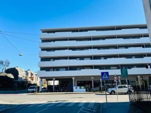 a parking lot in front of a large building at Junior Suite Apartment Eleven in Graz
