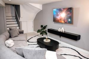 a living room with a couch and a table at 2BR Travelers Favorite Modern in Chicago
