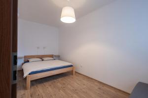Postel nebo postele na pokoji v ubytování Apartmán Pod Kopečkem