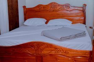 Ένα ή περισσότερα κρεβάτια σε δωμάτιο στο AIRPORT INN MOTEL