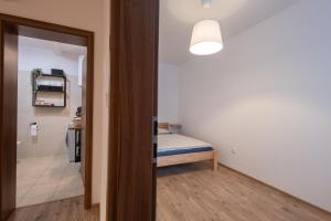 Postel nebo postele na pokoji v ubytování Apartmán Pod Kopečkem