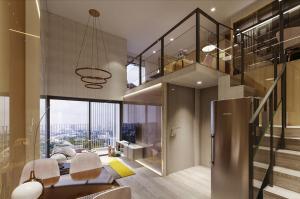 a large room with a staircase and a living room at The Rich Rama 9 Luxury Condos in Sathani Ban Hua Mak