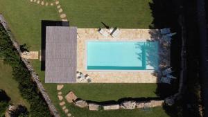 Bazén v ubytování Trullandia nebo v jeho okolí + 29 fotografií