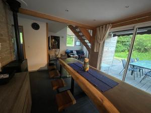 a kitchen and living room with a bar in a house at Chalet Les Prés Chaussottes in Gérardmer
