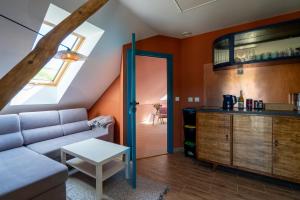 a living room with a couch and a table at Winnica Kosmos in Lubcza