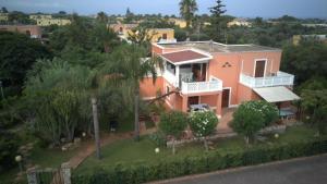 an aerial view of a house with palm trees at Le terrazze house with swimming pool in Terrasini in Terrasini