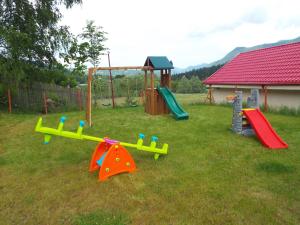 a group of playground equipment in a yard at Motel Flora in Lepşa