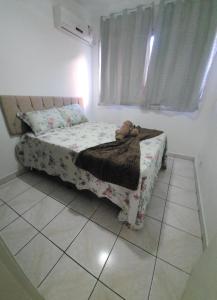 Ένα ή περισσότερα κρεβάτια σε δωμάτιο στο Apartamento temporada 2 quartos em Vila Velha