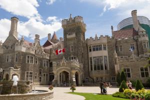 a castle with a canadian flag in front of it at Holiday Inn Toronto International Airport by IHG in Toronto
