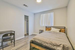 a bedroom with a bed and a desk and a window at Lovely Private Bedroom Near SoFi/USC in Los Angeles