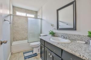 a bathroom with a sink and a toilet and a shower at Lovely Private Bedroom Near SoFi/USC in Los Angeles +19 photos