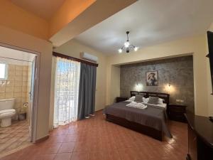 Postel nebo postele na pokoji v ubytování Oskar Hotel
