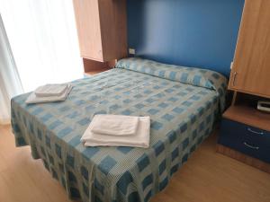 Katil atau katil-katil dalam bilik di Hotel Midi