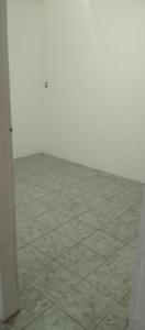 an empty room with white walls and a tile floor at Apartamento para FIG 2 in Garanhuns +3 photos