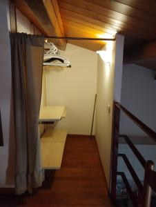 a small room with a bed and a curtain at Da Massimo in Cefalù