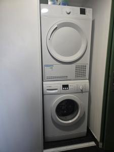 a washing machine and a dryer in a room at La Terrasse in Argenton lʼÉglise