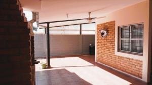 a view of a garage with a brick wall at The Posadas House in Posadas