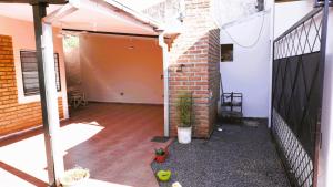 an outside view of a patio with a brick wall at The Posadas House in Posadas
