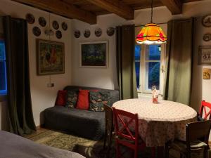 a living room with a table and a couch at Stavne 158 in Stavnoye