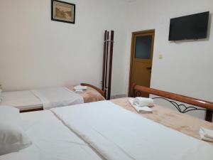 Postel nebo postele na pokoji v ubytování Guesthouse Reçka