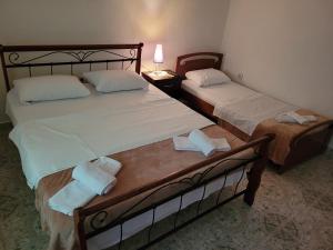 Postel nebo postele na pokoji v ubytování Guesthouse Reçka