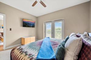 a bedroom with a bed and a window at Smoky View Haven- Indoor Pool, Playground, Walking Trail, Hot Tub in Pigeon Forge