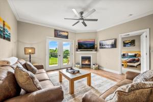 a living room with two couches and a fireplace at Smoky View Haven- Indoor Pool, Playground, Walking Trail, Hot Tub in Pigeon Forge