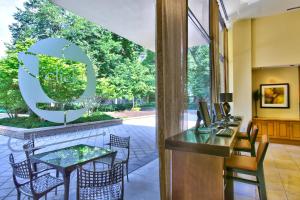 a dining room with a table and chairs and a sign that reads cafe at Spacius Apt W Excellent Amenities in Arlington