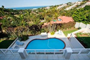 a view of a swimming pool and the ocean at Seaview Manor Exquisite Bed & Breakfast in Durban