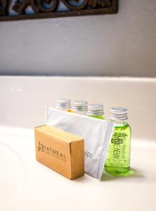 a box and three glass bottles on a shelf at Karsten Maricopa in Maricopa