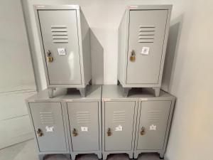 three metal lockers sitting next to each other at Naxos City Hostel in Naxos Chora