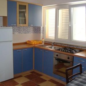 Kuchyň nebo kuchyňský kout v ubytování Apartments Markota