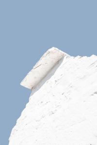 a white mountain with a blue sky in the background at La chiave antica in Alberobello