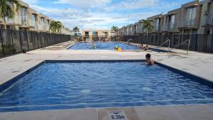 a group of pools with people playing in them at Beautiful Cozy House - Hermosa Casa Acogedora in Ibagué